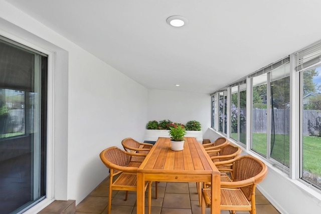 sunroom / solarium with tile patterned floors