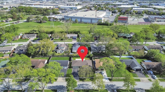 aerial view of property and surrounding area with nearby suburban area