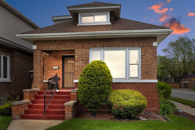 7559 S Michigan Ave, Chicago, IL 60619 - view of front of home with brick siding, roof with shingles, and a porch