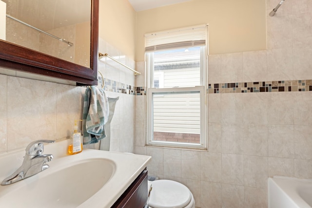 7559 S Michigan Ave, Chicago, IL 60619 - bathroom featuring tile walls, toilet, vanity, and  shower combination