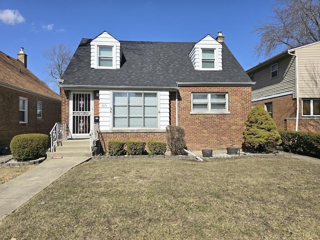 40 166th Pl, Calumet City, IL 60409 - view of front facade featuring brick siding, a front lawn, and a shingled roof