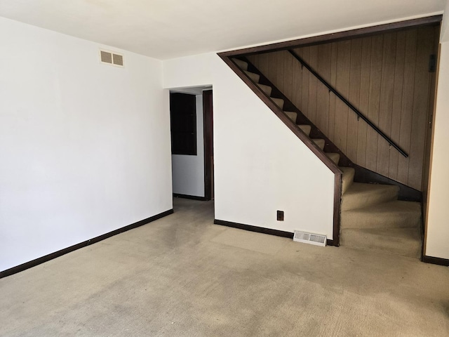 40 166th Pl, Calumet City, IL 60409 - below grade area with stairway, baseboards, visible vents, and light carpet