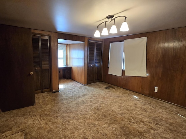 40 166th Pl, Calumet City, IL 60409 - unfurnished room featuring wood walls and carpet