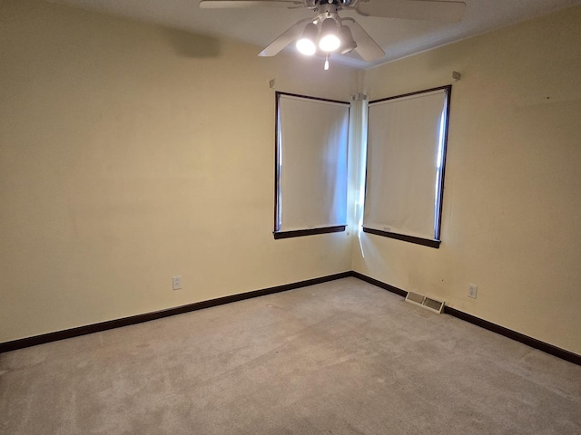 40 166th Pl, Calumet City, IL 60409 - spare room featuring light carpet, visible vents, baseboards, and ceiling fan