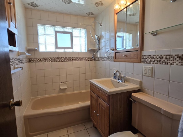 40 166th Pl, Calumet City, IL 60409 - full bathroom featuring vanity, washtub / shower combination, tile patterned flooring, tile walls, and toilet