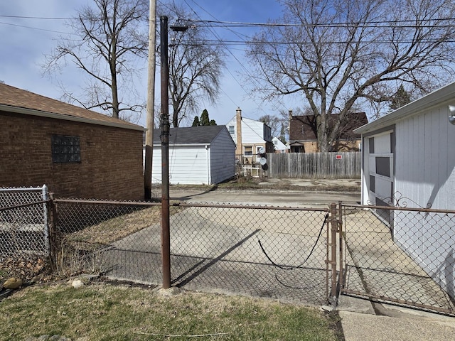 40 166th Pl, Calumet City, IL 60409 - view of yard featuring a garage, an outdoor structure, and fence