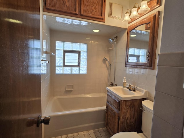 40 166th Pl, Calumet City, IL 60409 - full bath featuring toilet, vanity, tile walls, and shower / bath combination