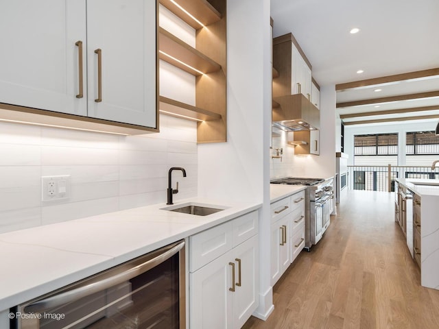2141 W Grace St, Chicago, IL 60618 - kitchen featuring wine cooler, stainless steel appliances, decorative backsplash, light wood-style floors, and recessed lighting