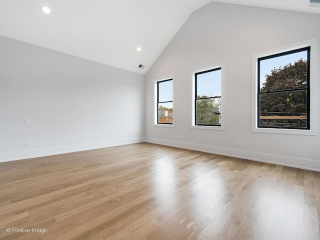 2141 W Grace St, Chicago, IL 60618 - spare room featuring light wood finished floors, recessed lighting, and high vaulted ceiling