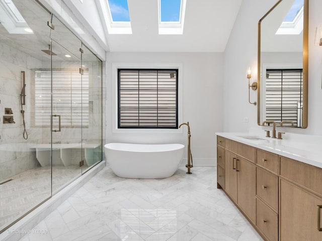 2141 W Grace St, Chicago, IL 60618 - bathroom featuring a skylight, marble finish floors, a shower stall, a freestanding bath, and lofted ceiling