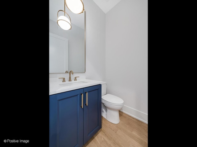 2141 W Grace St, Chicago, IL 60618 - bathroom featuring vanity and wood finished floors