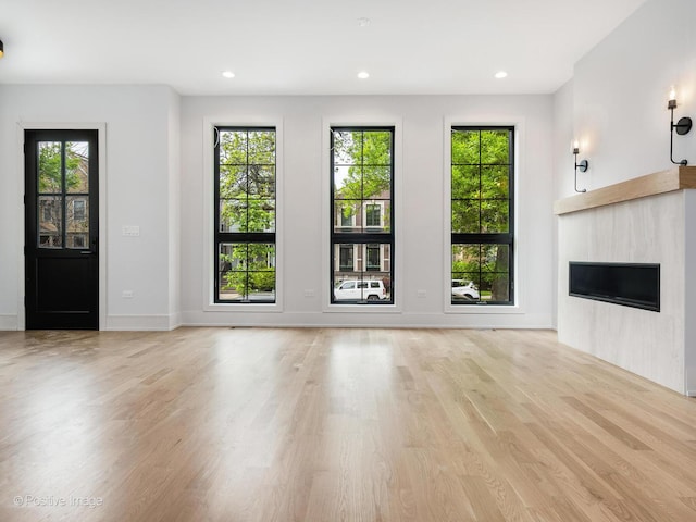 2141 W Grace St, Chicago, IL 60618 - unfurnished living room with a fireplace, healthy amount of natural light, light wood-type flooring, and recessed lighting