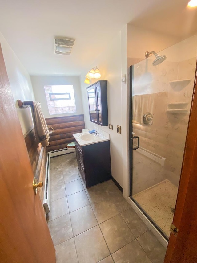 full bathroom with a stall shower, vanity, tile patterned flooring, and visible vents