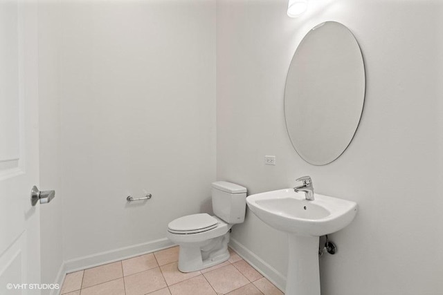 225 N Columbus Dr Unit 5703, Chicago, IL 60601 - half bath with tile patterned flooring, toilet, and baseboards