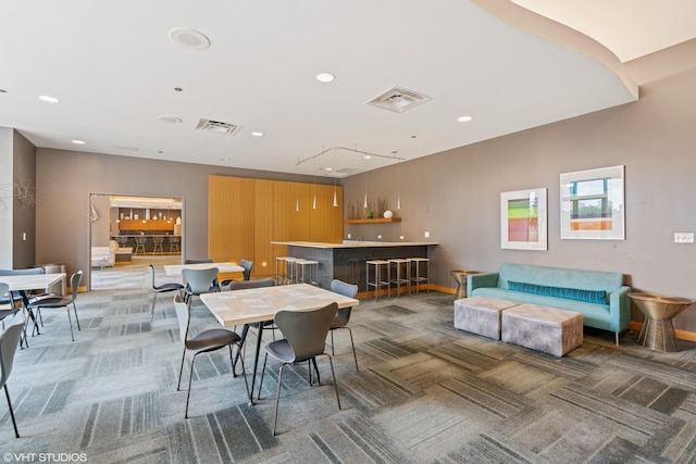 225 N Columbus Dr Unit 5703, Chicago, IL 60601 - dining area featuring a community bar, light carpet, recessed lighting, and baseboards