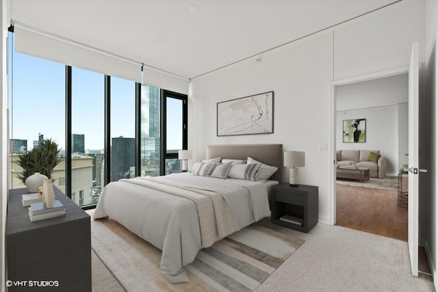 225 N Columbus Dr Unit 5703, Chicago, IL 60601 - bedroom featuring floor to ceiling windows and light carpet