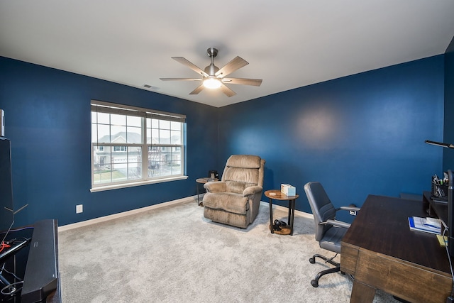 office area featuring visible vents, baseboards, a ceiling fan, and carpet floors
