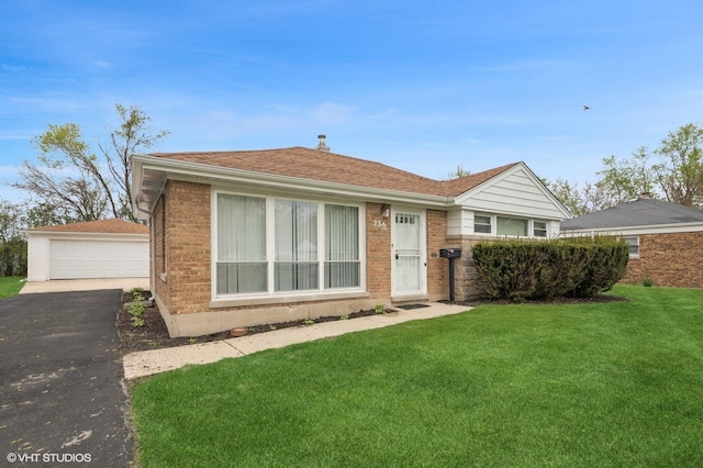 236 Indianwood Blvd, Park Forest, IL 60466 - bungalow-style home featuring brick siding, a front lawn, an outbuilding, and a detached garage