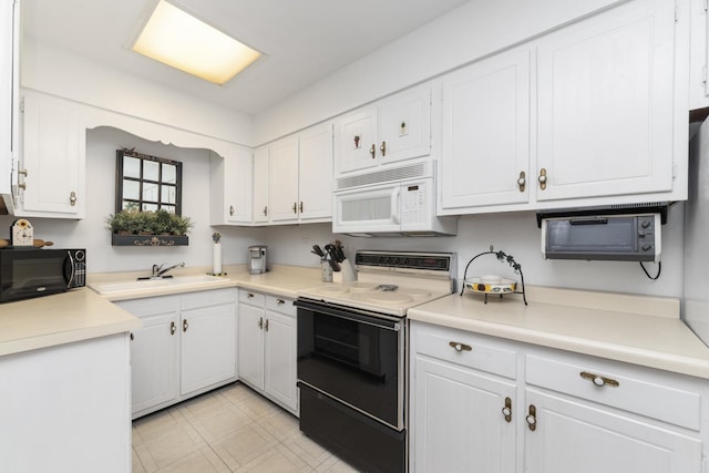 4221 Saratoga Ave Unit 310-A, Downers Grove, IL 60515 - kitchen with white cabinetry, a sink, white microwave, black microwave, and range with electric cooktop