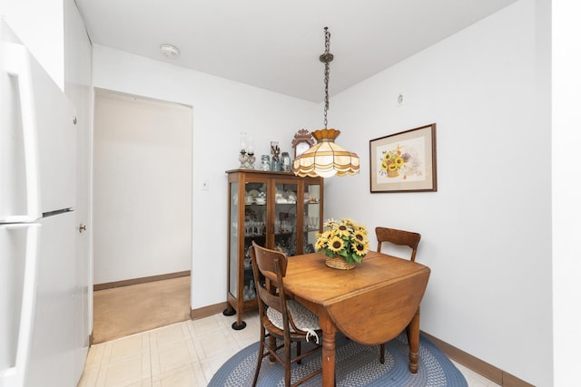 4221 Saratoga Ave Unit 310-A, Downers Grove, IL 60515 - dining space with baseboards and light floors