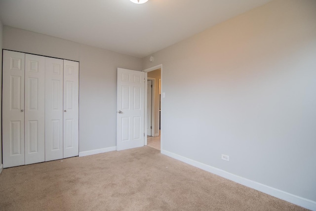 1344 Superior Ave, Calumet City, IL 60409 - unfurnished bedroom featuring a closet, baseboards, and carpet floors
