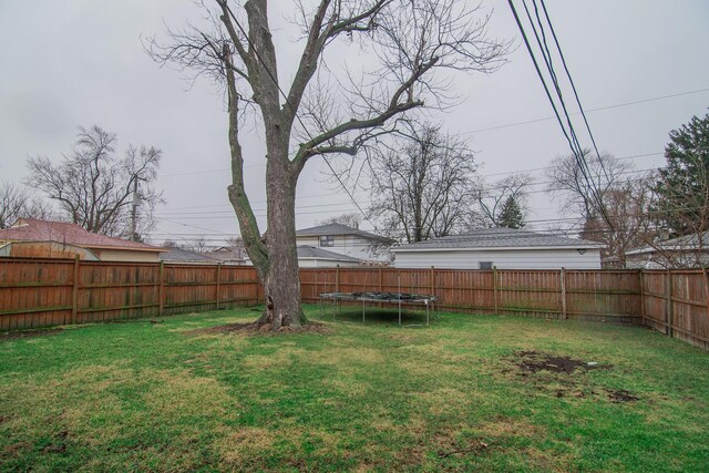 1344 Superior Ave, Calumet City, IL 60409 - view of yard with a trampoline and a fenced backyard