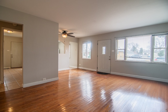 1344 Superior Ave, Calumet City, IL 60409 - foyer entrance with baseboards, plenty of natural light, light wood-style floors, and ceiling fan