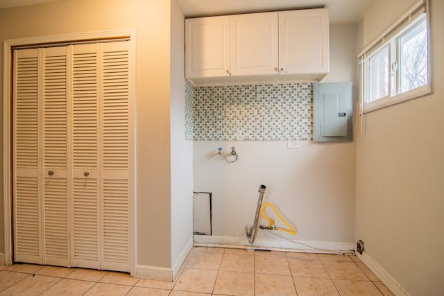 1344 Superior Ave, Calumet City, IL 60409 - laundry room featuring electric panel, light tile patterned floors, cabinet space, and baseboards