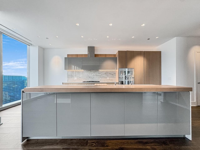 363 E Wacker Dr Unit 6306, Chicago, IL 60601 - kitchen with modern cabinets, expansive windows, decorative backsplash, a large island with sink, and wood finished floors