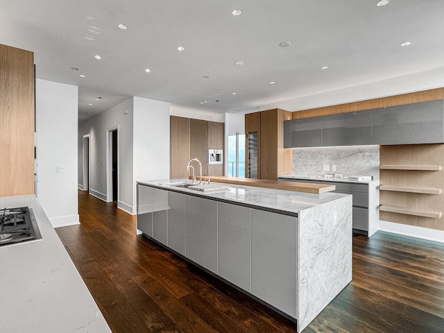 363 E Wacker Dr Unit 6306, Chicago, IL 60601 - kitchen featuring modern cabinets, dark wood-style flooring, a sink, recessed lighting, and a large island
