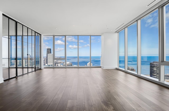 363 E Wacker Dr Unit 6306, Chicago, IL 60601 - unfurnished room with expansive windows, a water view, wood finished floors, and healthy amount of natural light