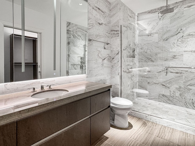 363 E Wacker Dr Unit 6306, Chicago, IL 60601 - full bathroom featuring toilet, a marble finish shower, and vanity