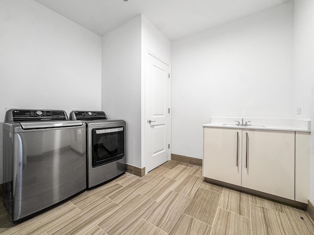 363 E Wacker Dr Unit 6306, Chicago, IL 60601 - laundry room featuring washer and clothes dryer, cabinet space, baseboards, and wood tiled floors