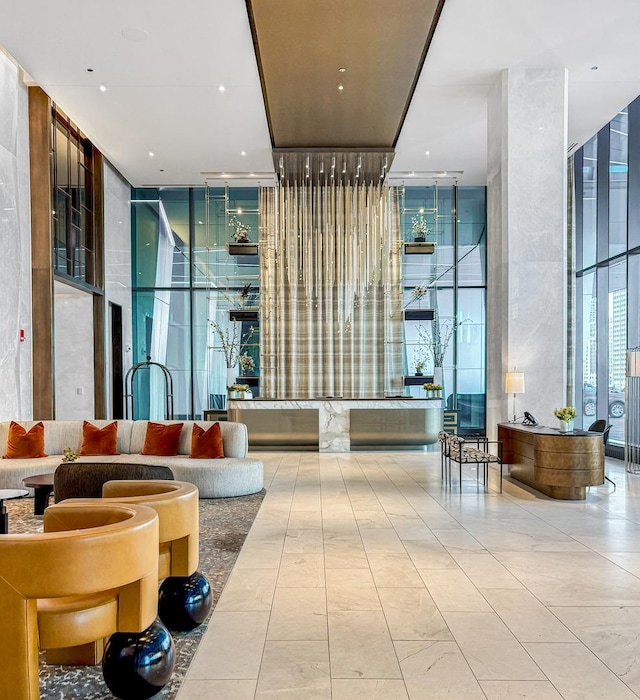363 E Wacker Dr Unit 6306, Chicago, IL 60601 - building lobby with a wall of windows and a towering ceiling