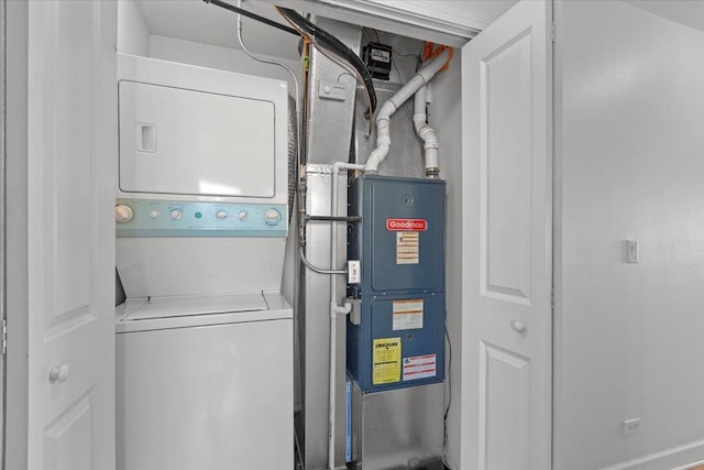laundry room with laundry area and stacked washer and dryer