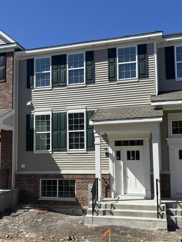 3905 Neubauer Cir Unit 204, Lindenhurst, IL 60046 - view of front facade with brick siding