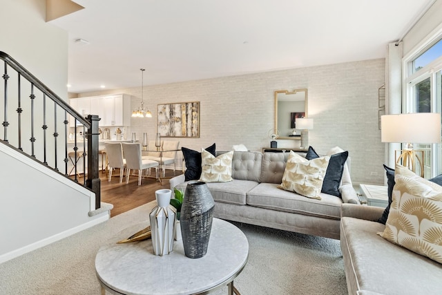 3905 Neubauer Cir Unit 204, Lindenhurst, IL 60046 - living room featuring stairway, a chandelier, and wood finished floors
