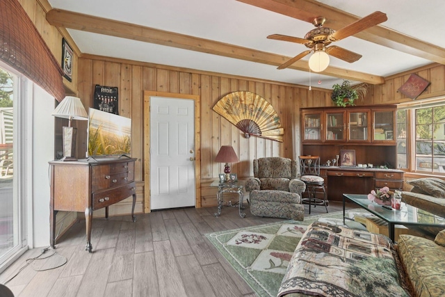 7616 Orchard Rd, Wonder Lake, IL 60097 - living area with beam ceiling, wood walls, hardwood / wood-style flooring, and a ceiling fan