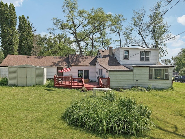 7616 Orchard Rd, Wonder Lake, IL 60097 - rear view of house with a deck, a storage unit, a lawn, and a chimney