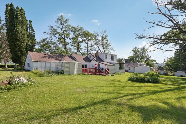 7616 Orchard Rd, Wonder Lake, IL 60097 - view of green lawn with a deck