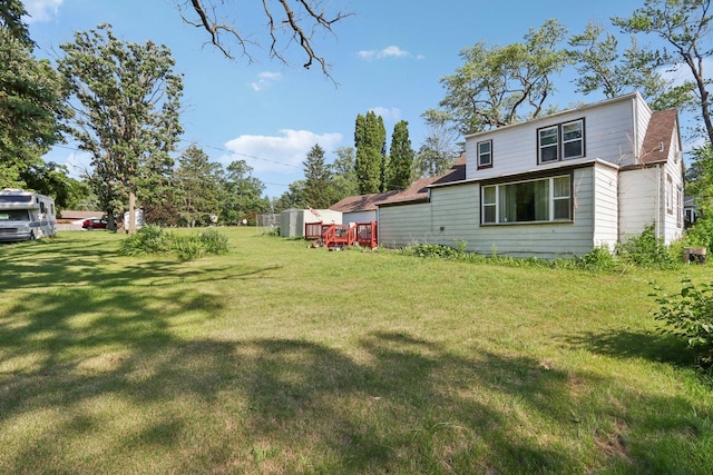 7616 Orchard Rd, Wonder Lake, IL 60097 - view of green lawn with a shed