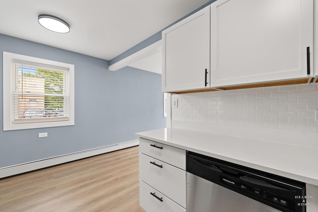 2411 W Balmoral Ave Unit 1F, Chicago, IL 60625 - kitchen with stainless steel dishwasher, white cabinets, tasteful backsplash, light countertops, and light wood finished floors
