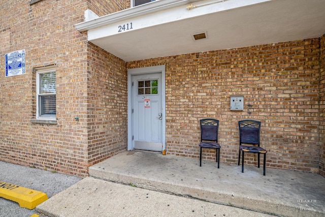2411 W Balmoral Ave Unit 1F, Chicago, IL 60625 - doorway to property with brick siding