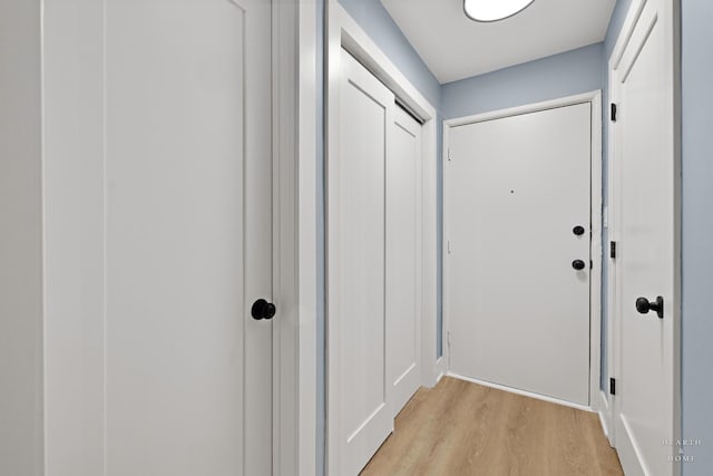 2411 W Balmoral Ave Unit 1F, Chicago, IL 60625 - doorway to outside featuring light wood-type flooring