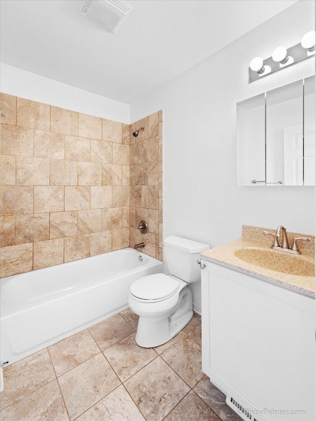 full bathroom with visible vents, toilet, tile patterned floors, vanity, and shower / washtub combination