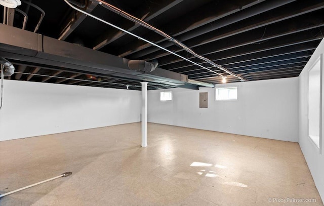 basement featuring electric panel