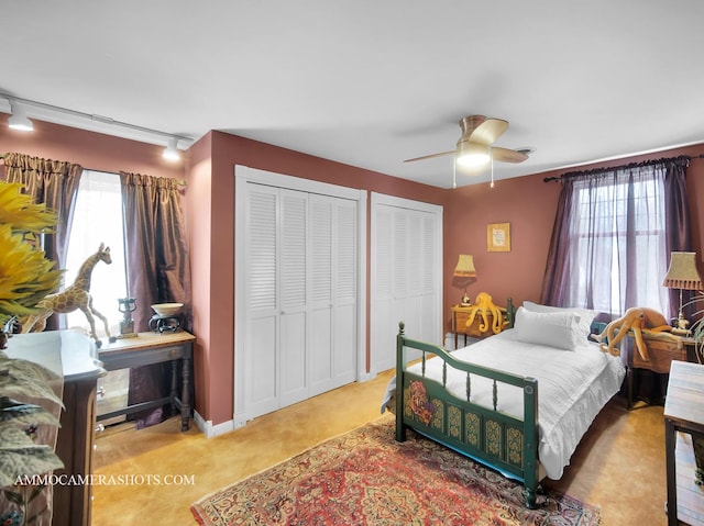 173 Pomeroy Ave, Crystal Lake, IL 60014 - bedroom featuring multiple closets, multiple windows, ceiling fan, and carpet floors