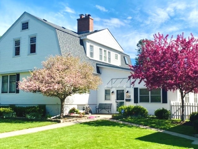173 Pomeroy Ave, Crystal Lake, IL 60014 - rear view of property with a gambrel roof, a chimney, and roof with shingles