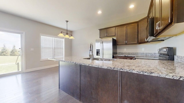 750 Sedgegrass Dr, Champaign, IL 61822 - kitchen with electric range oven, stainless steel fridge with ice dispenser, a sink, dark wood finished floors, and light stone countertops