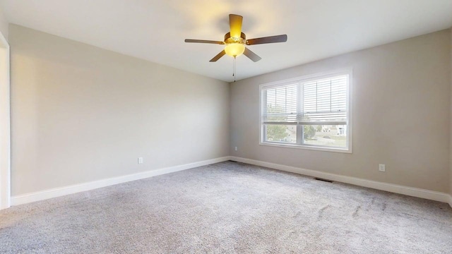 750 Sedgegrass Dr, Champaign, IL 61822 - carpeted empty room featuring baseboards and a ceiling fan